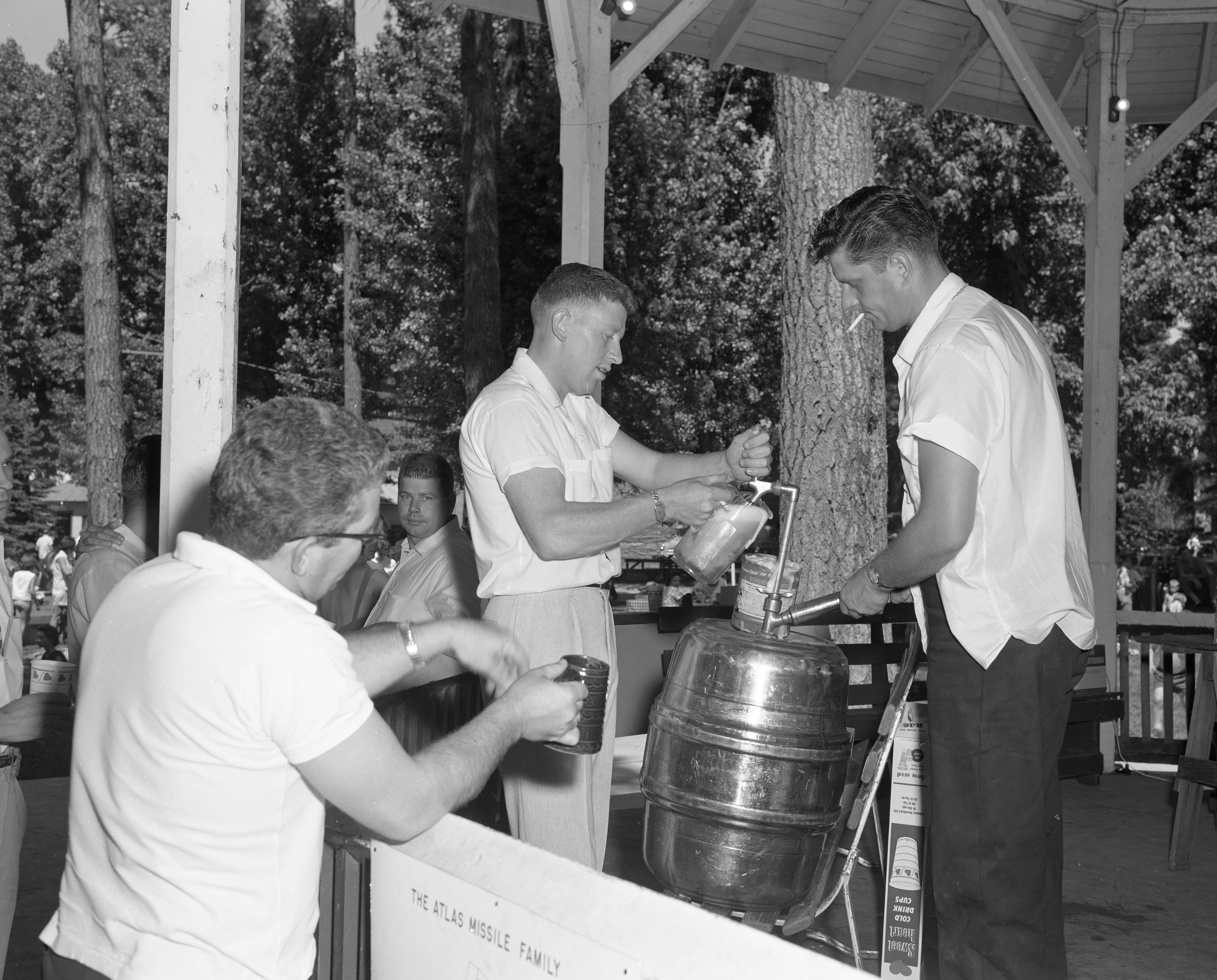 The draft beer committee ensuring that people have refreshments during the picnic