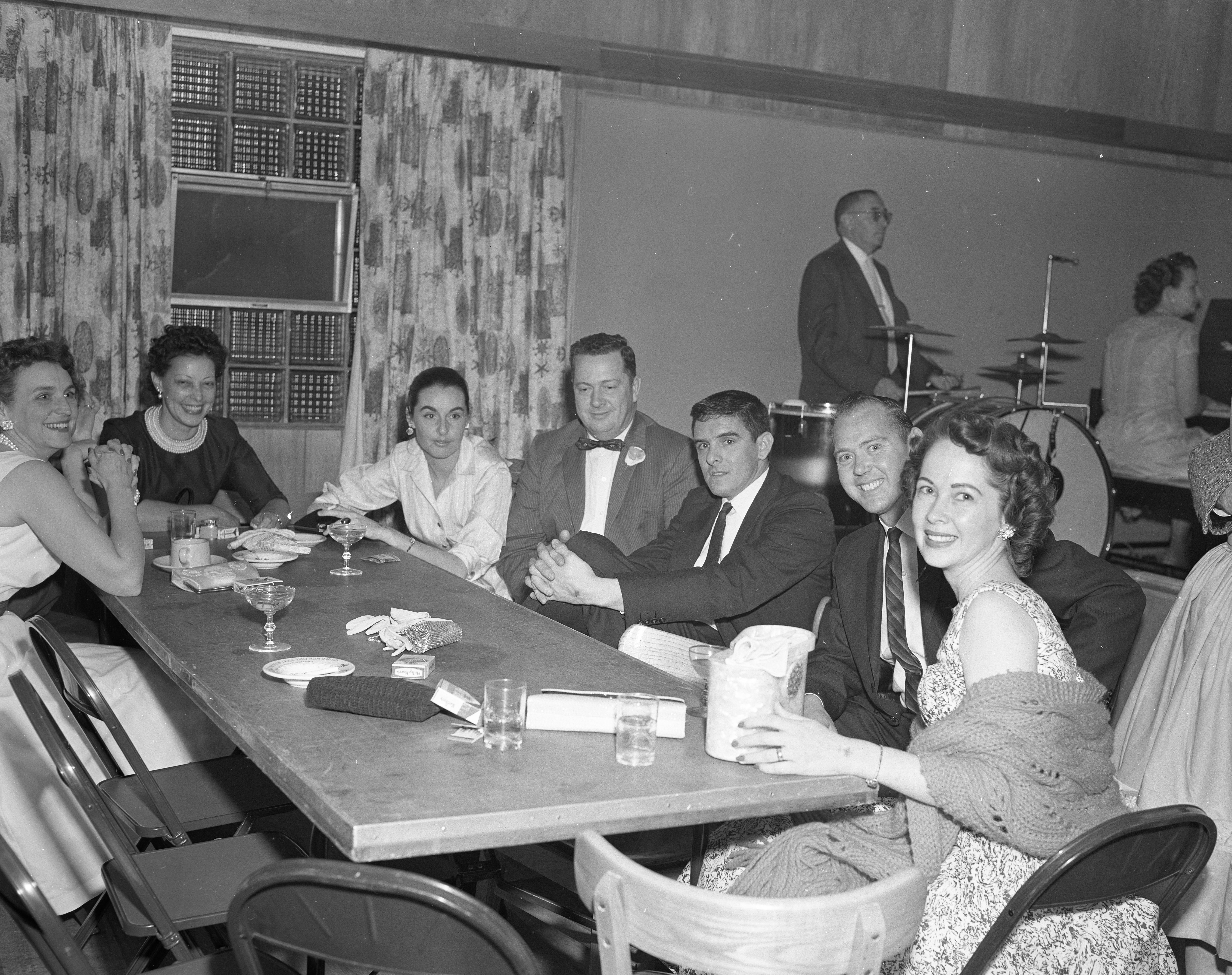 Convair employees and others seated together at the dance.