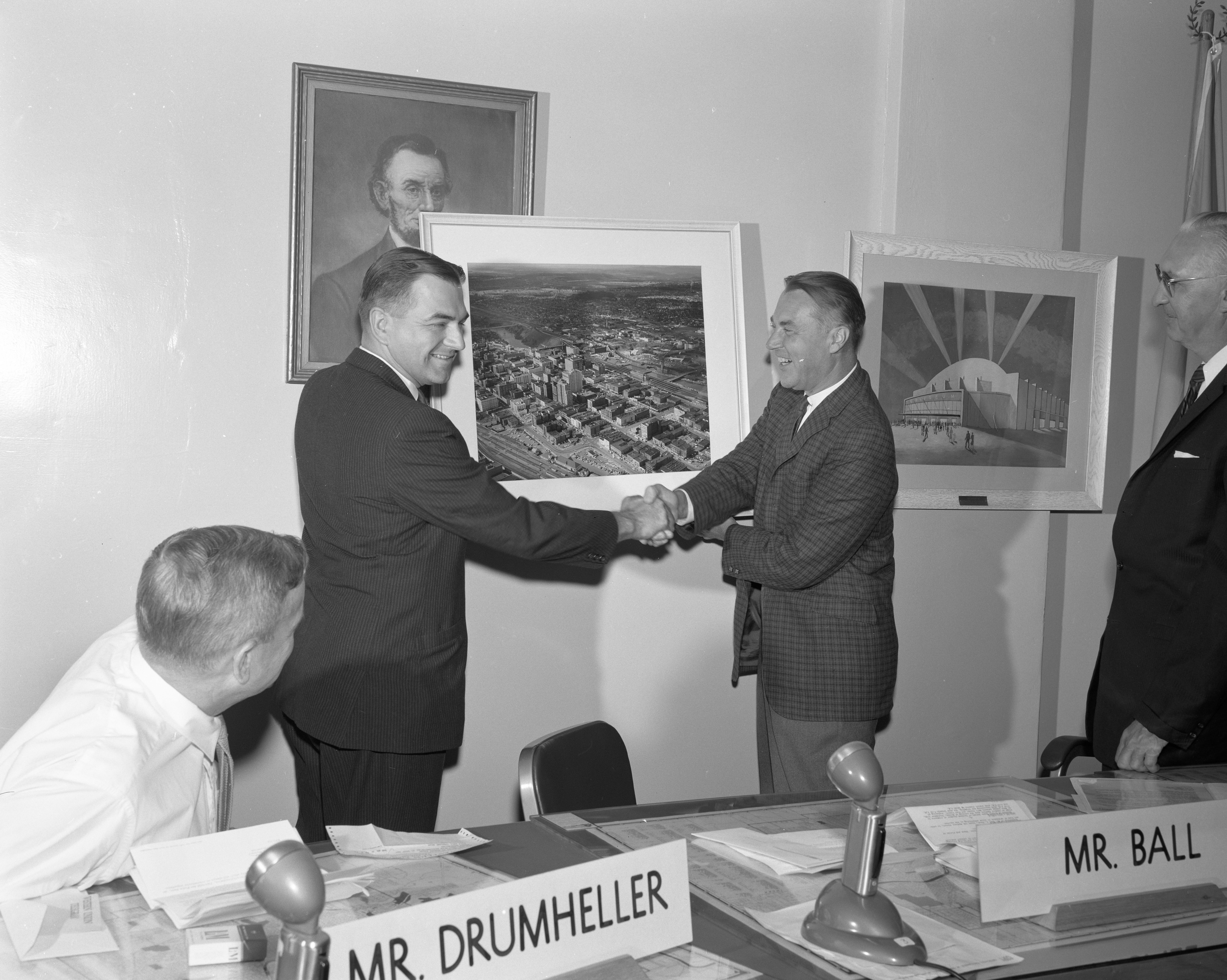 William F. Chana presenting framed photograph of Spokane, Washington, to the Spokane mayor, Neal R. Fosseen, on July 31st, 1961. 